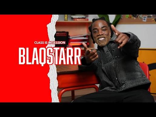 DJ BLAQSTARR seated at a school desk pointing at the camera, with the words CLASS IS IN SESSION